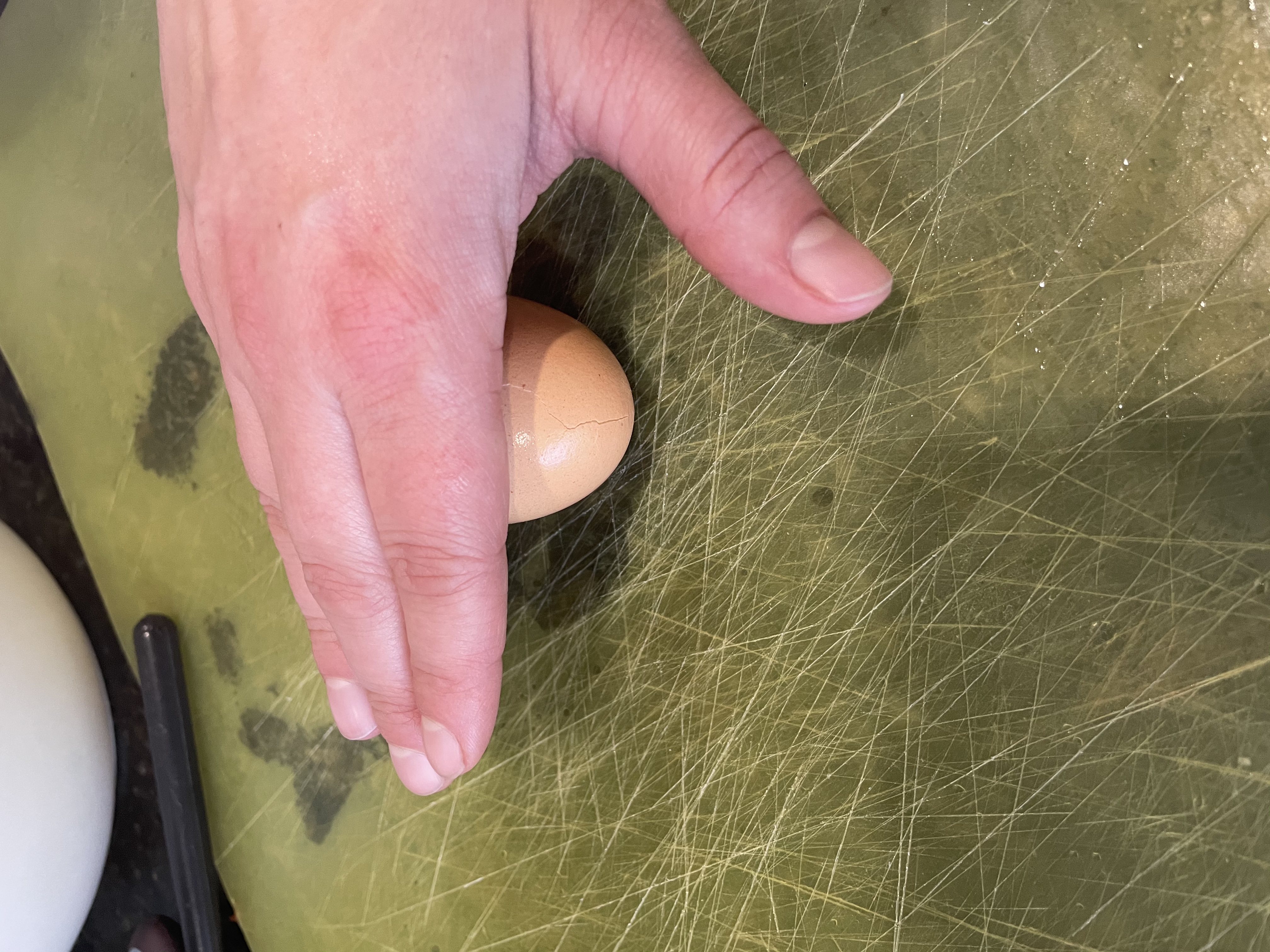 Cracking hard boiled egg